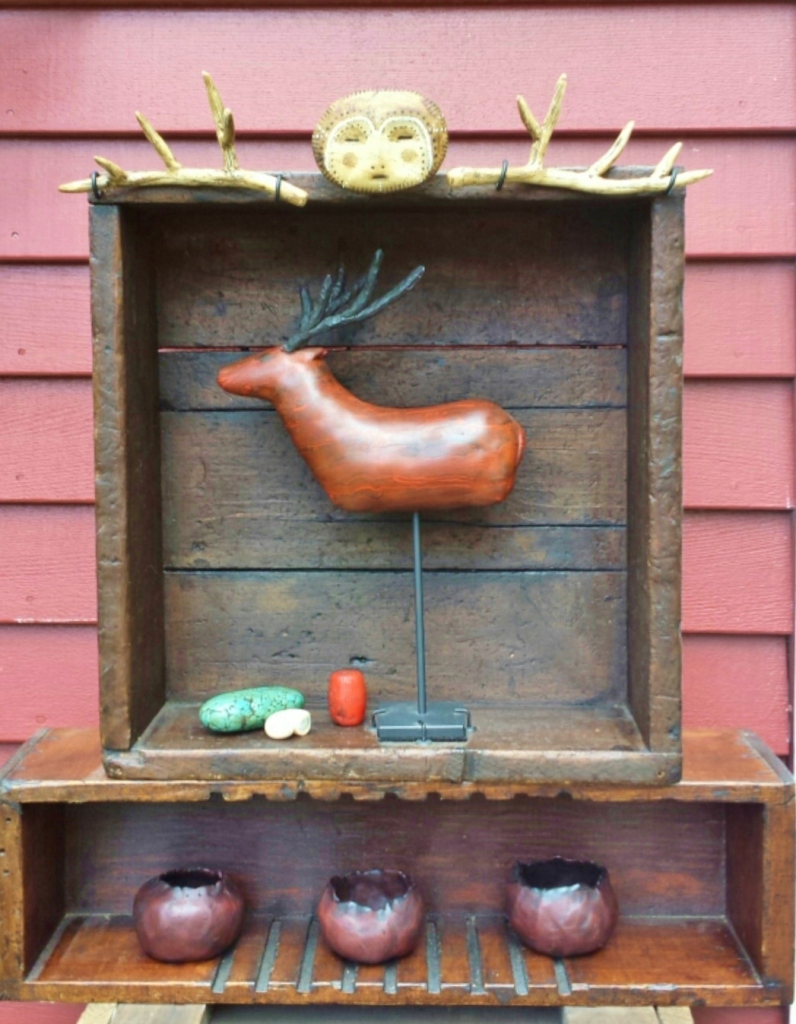 I made the deer last year, but I didn't know what I was going to do with him til a few months ago. Everything in this display is polymer clay (except the antique boxes.)
